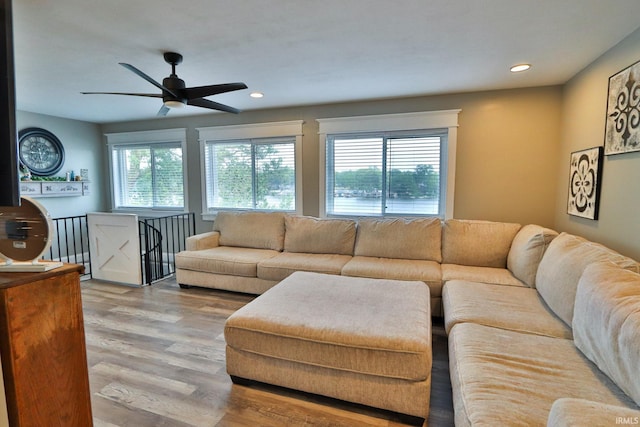 5547 N W Shafer Dr, Monticello, IN 47960 - living room with wood finished floors, ceiling fan, and recessed lighting