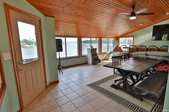 5547 N W Shafer Dr, Monticello, IN 47960 - sunroom with vaulted ceiling, wooden ceiling, tile patterned floors, a water view, and baseboards