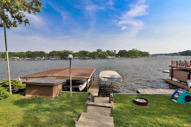5547 N W Shafer Dr, Monticello, IN 47960 - dock area with a water view, boat lift, and a yard