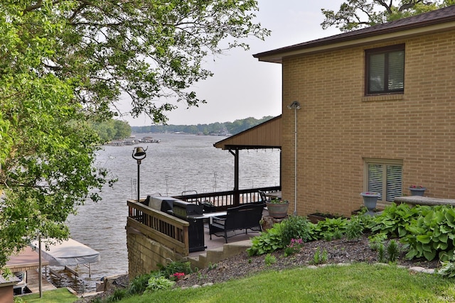 5547 N W Shafer Dr, Monticello, IN 47960 - view of property exterior with a water view and brick siding