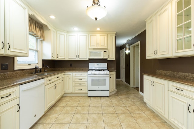 1402 Hampshire Dr, South Bend, IN 46614 - kitchen featuring white appliances, a sink, glass insert cabinets, light tile patterned floors, and recessed lighting