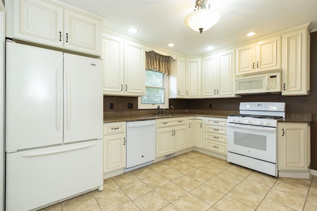 1402 Hampshire Dr, South Bend, IN 46614 - kitchen featuring white appliances, light tile patterned flooring, cream cabinets, recessed lighting, and a sink