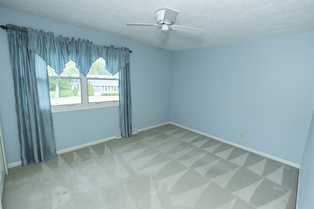 1402 Hampshire Dr, South Bend, IN 46614 - unfurnished room with carpet flooring, a textured ceiling, baseboards, and ceiling fan