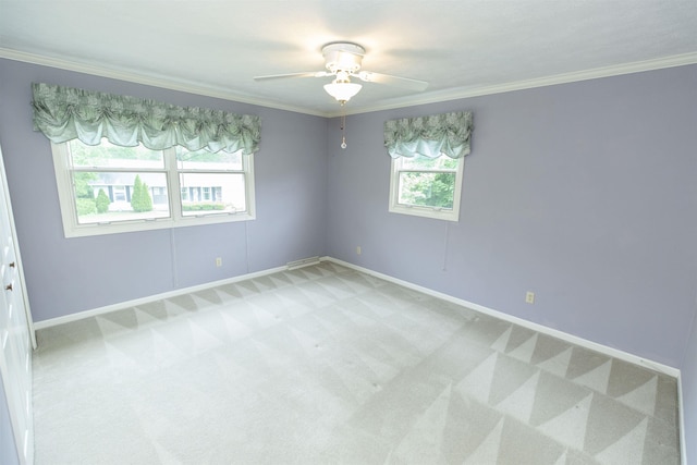 1402 Hampshire Dr, South Bend, IN 46614 - spare room with light carpet, healthy amount of natural light, a ceiling fan, crown molding, and baseboards