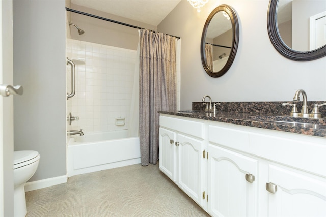 1402 Hampshire Dr, South Bend, IN 46614 - full bathroom featuring toilet, shower / bath combination with curtain, double vanity, and baseboards