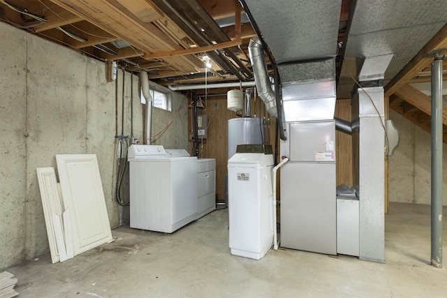 1402 Hampshire Dr, South Bend, IN 46614 - below grade area featuring washing machine and clothes dryer, water heater, and a water softener