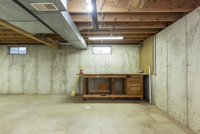 1402 Hampshire Dr, South Bend, IN 46614 - basement featuring a workshop area and healthy amount of natural light