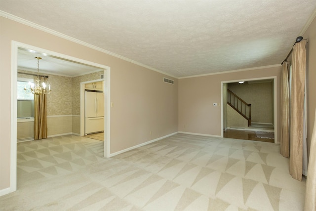 1402 Hampshire Dr, South Bend, IN 46614 - empty room with light colored carpet, stairs, a chandelier, crown molding, and baseboards