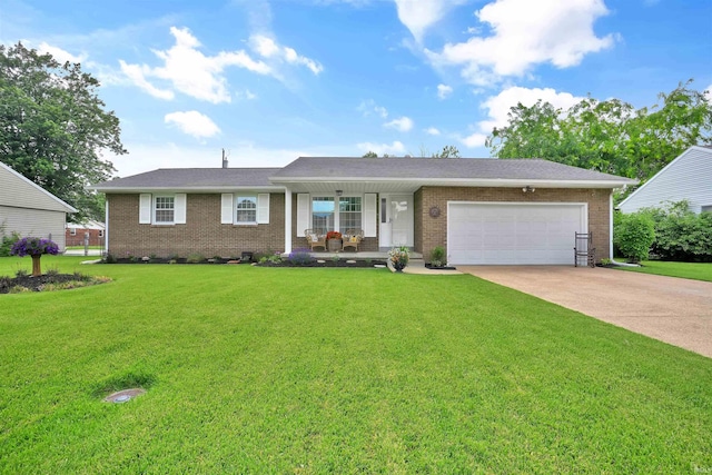 1908 N Iroquois Dr, Evansville, IN 47715 - ranch-style house with covered porch, brick siding, an attached garage, and a front yard