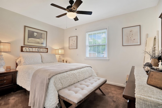 1908 N Iroquois Dr, Evansville, IN 47715 - bedroom with dark carpet, baseboards, and a ceiling fan