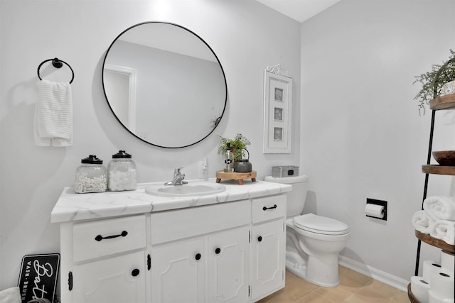 1908 N Iroquois Dr, Evansville, IN 47715 - bathroom with vanity, toilet, baseboards, and tile patterned floors