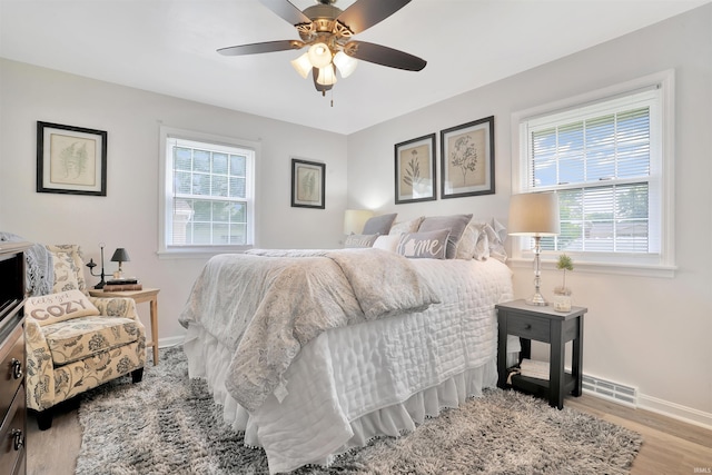 1908 N Iroquois Dr, Evansville, IN 47715 - bedroom featuring wood finished floors, baseboards, and ceiling fan