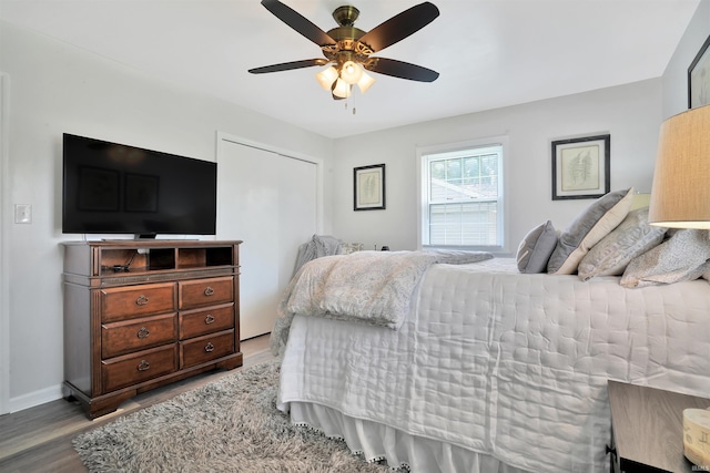 1908 N Iroquois Dr, Evansville, IN 47715 - bedroom featuring wood finished floors, a ceiling fan, and baseboards