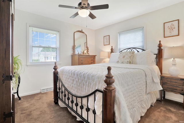 1908 N Iroquois Dr, Evansville, IN 47715 - bedroom featuring dark carpet, baseboards, and ceiling fan