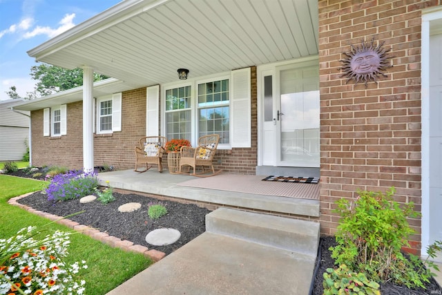 1908 N Iroquois Dr, Evansville, IN 47715 - view of exterior entry featuring a porch and brick siding