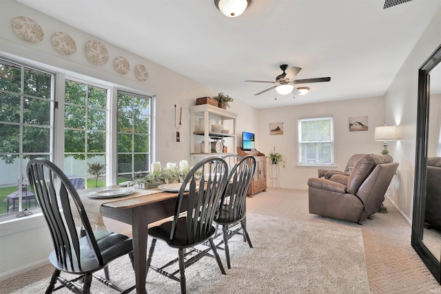 1908 N Iroquois Dr, Evansville, IN 47715 - carpeted dining room with ceiling fan and baseboards