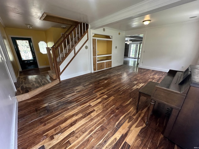 1020 E State St, Albany, IN 47320 - unfurnished living room featuring hardwood / wood-style floors, stairway, baseboards, crown molding, and a chandelier
