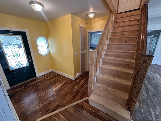 1020 E State St, Albany, IN 47320 - entrance foyer with dark wood-style flooring, stairs, and baseboards