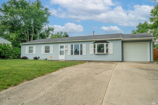1011 N Lincolnshire Blvd, Marion, IN 46952 - ranch-style home with concrete driveway, a garage, and a front yard