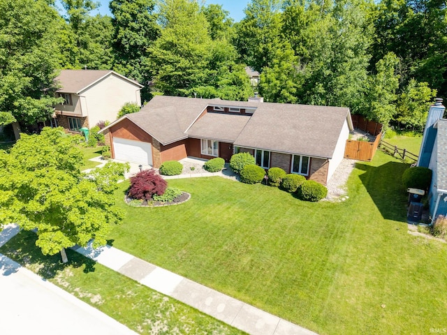 8816 Beacon Woods Pl, Fort Wayne, IN 46804 - mid-century inspired home featuring an attached garage, brick siding, and roof with shingles