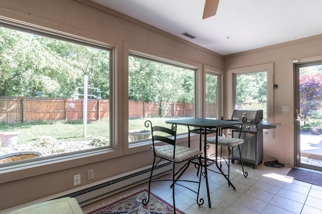 8816 Beacon Woods Pl, Fort Wayne, IN 46804 - dining space with light tile patterned floors, a ceiling fan, and a baseboard radiator
