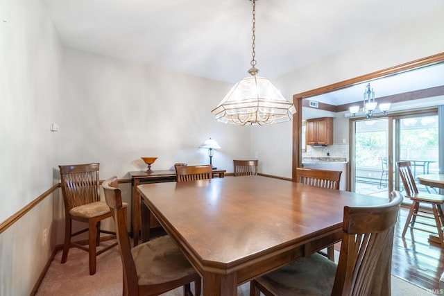 8816 Beacon Woods Pl, Fort Wayne, IN 46804 - dining room with a chandelier and baseboards