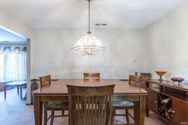 8816 Beacon Woods Pl, Fort Wayne, IN 46804 - dining room with light carpet and a chandelier