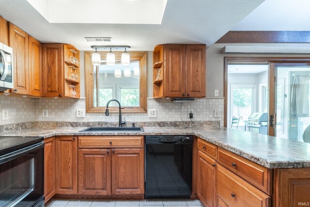 8816 Beacon Woods Pl, Fort Wayne, IN 46804 - kitchen featuring black appliances, a sink, open shelves, a peninsula, and brown cabinetry