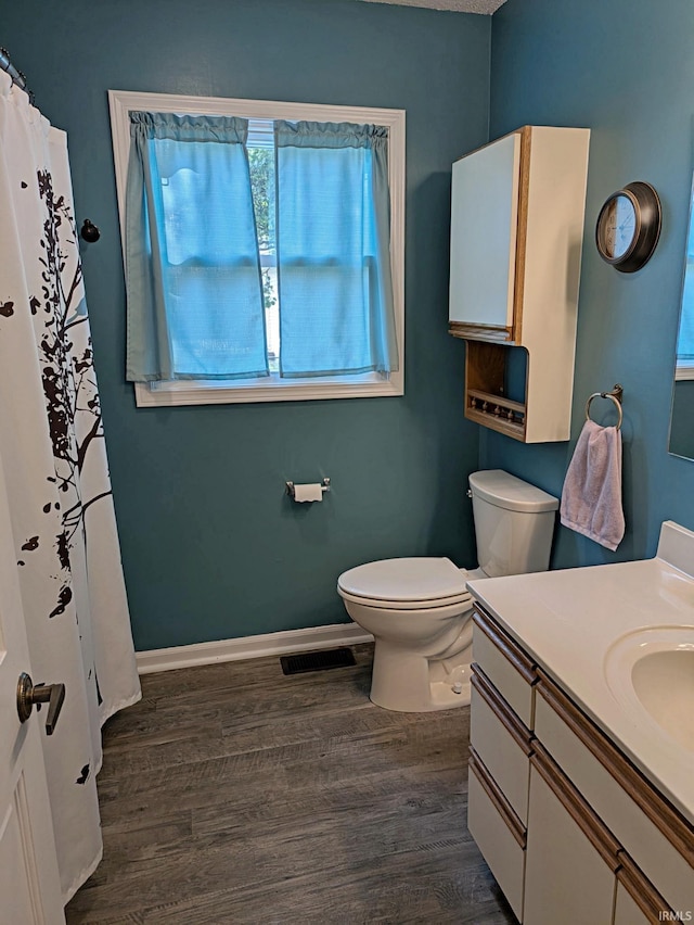 5 E Viola Ave, Washington, IN 47501 - bathroom with wood finished floors, vanity, toilet, and baseboards