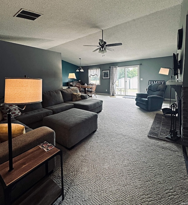 5 E Viola Ave, Washington, IN 47501 - living room with carpet flooring, a ceiling fan, a textured ceiling, and vaulted ceiling