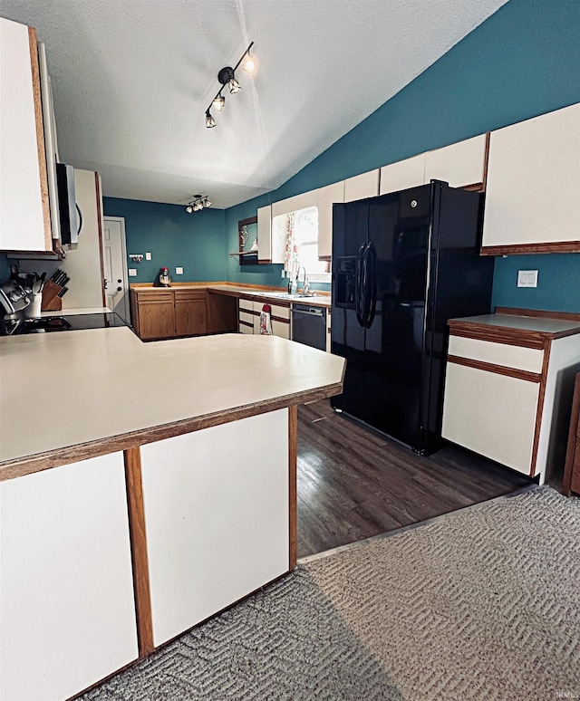 5 E Viola Ave, Washington, IN 47501 - kitchen with black fridge, range, dishwashing machine, vaulted ceiling, and a peninsula