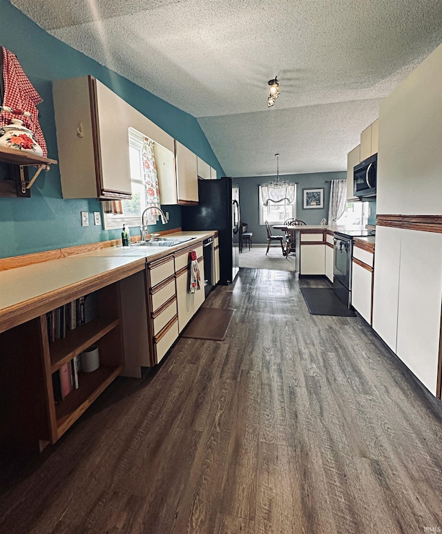5 E Viola Ave, Washington, IN 47501 - kitchen with electric range, stainless steel microwave, dark wood-style flooring, a chandelier, and healthy amount of natural light