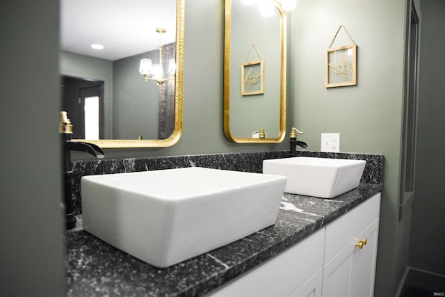545 Bennett Rd, Bedford, IN 47421 - bathroom featuring double vanity and a chandelier
