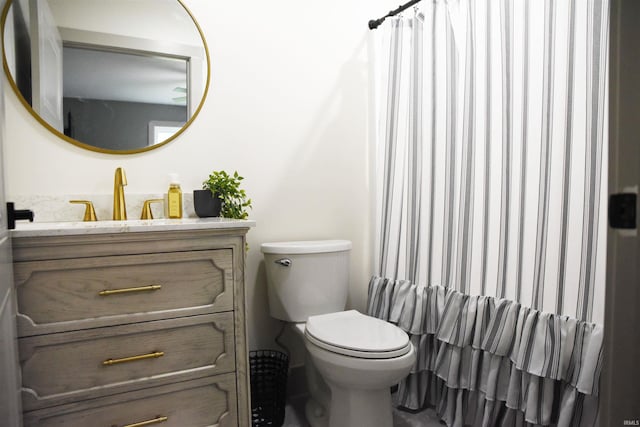 545 Bennett Rd, Bedford, IN 47421 - full bath featuring vanity, toilet, and a shower with shower curtain