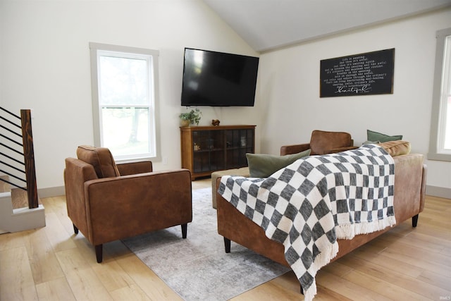 545 Bennett Rd, Bedford, IN 47421 - living area with stairs, light wood finished floors, and vaulted ceiling
