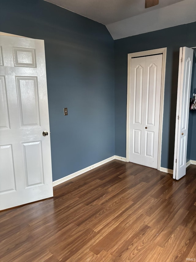 4026 S Lafayette St, Fort Wayne, IN 46806 - unfurnished bedroom featuring baseboards, wood finished floors, and lofted ceiling