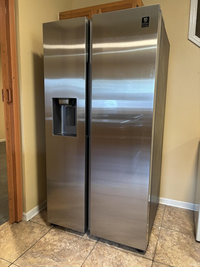 4026 S Lafayette St, Fort Wayne, IN 46806 - detailed view of stainless steel fridge with ice dispenser and baseboards