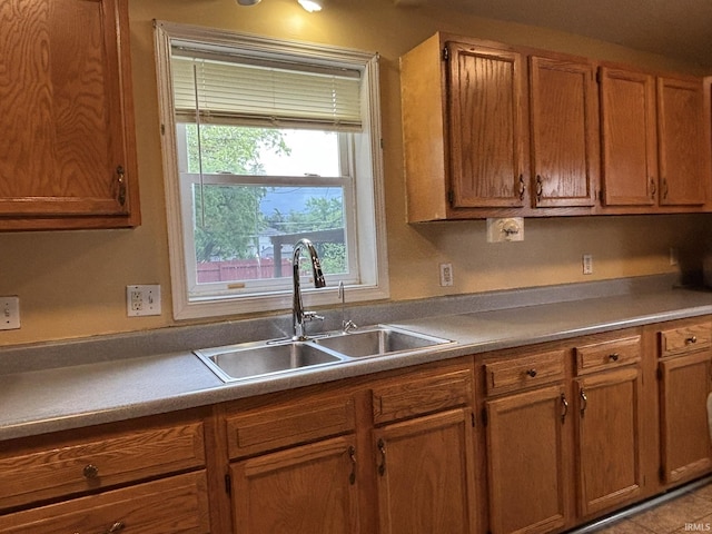 4026 S Lafayette St, Fort Wayne, IN 46806 - kitchen featuring a sink and brown cabinets