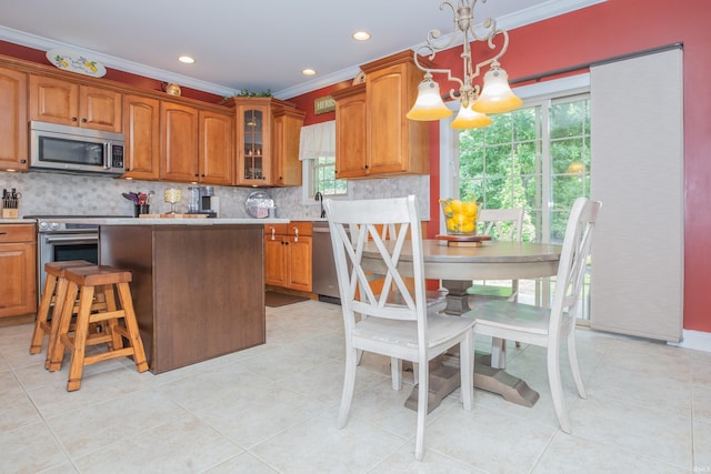 9076 Halston Cir, Newburgh, IN 47630 - kitchen with appliances with stainless steel finishes, ornamental molding, brown cabinets, light countertops, and decorative backsplash