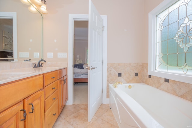 9076 Halston Cir, Newburgh, IN 47630 - ensuite bathroom featuring vanity, a garden tub, and tile patterned floors