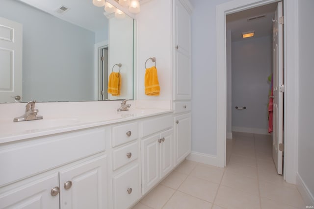 9076 Halston Cir, Newburgh, IN 47630 - bathroom with double vanity, tile patterned flooring, and baseboards