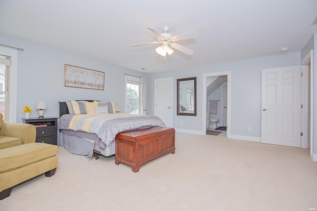 9076 Halston Cir, Newburgh, IN 47630 - carpeted bedroom featuring baseboards, ensuite bath, and a ceiling fan