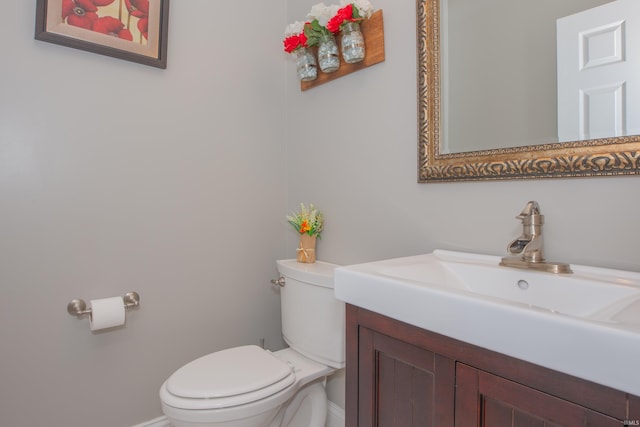 9076 Halston Cir, Newburgh, IN 47630 - half bathroom featuring toilet, vanity, and baseboards
