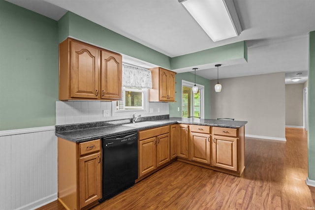 9391 E 100 N, Greentown, IN 46936 - kitchen with dishwasher, a sink, dark countertops, dark wood-type flooring, and a peninsula