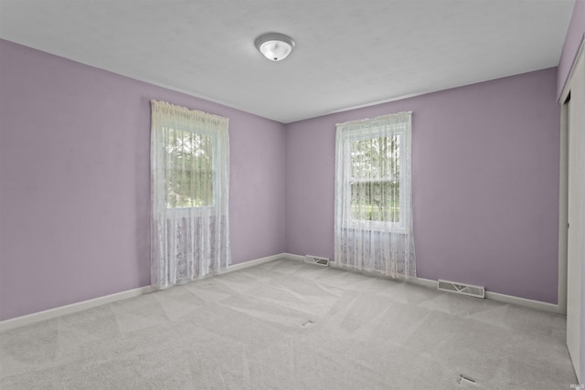 9391 E 100 N, Greentown, IN 46936 - spare room with healthy amount of natural light, carpet flooring, and baseboards