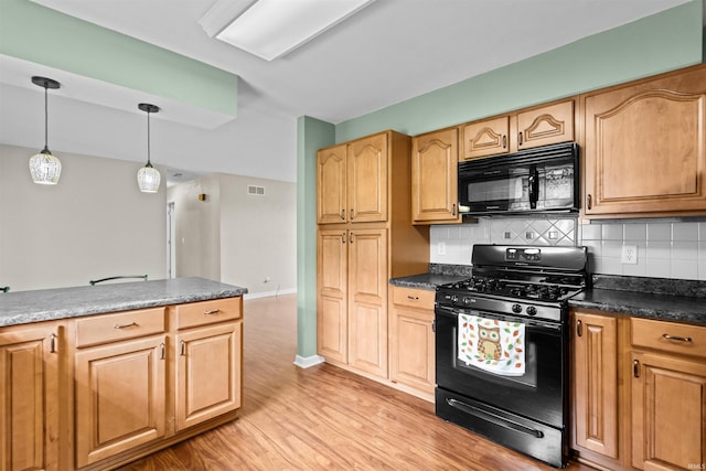 9391 E 100 N, Greentown, IN 46936 - kitchen with black appliances, light wood-style flooring, decorative backsplash, dark countertops, and pendant lighting
