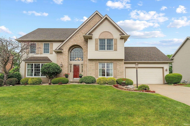 17813 Bromley Chase, South Bend, IN 46614 - traditional-style house with brick siding, driveway, a garage, and a front yard