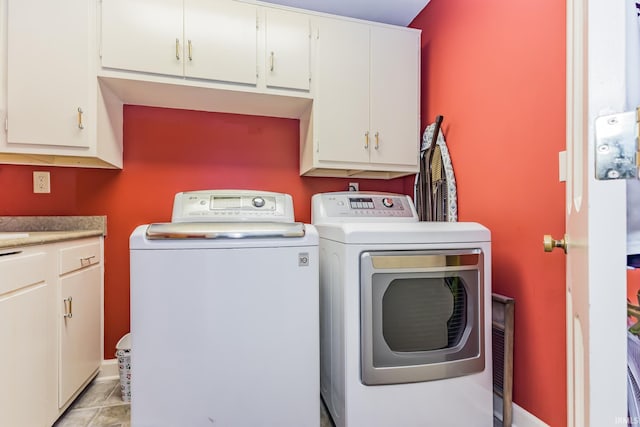 8804 W Tulip Tree Dr, Muncie, IN 47304 - laundry area featuring cabinet space and independent washer and dryer