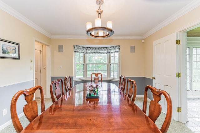 8804 W Tulip Tree Dr, Muncie, IN 47304 - dining space with crown molding, a chandelier, and baseboards