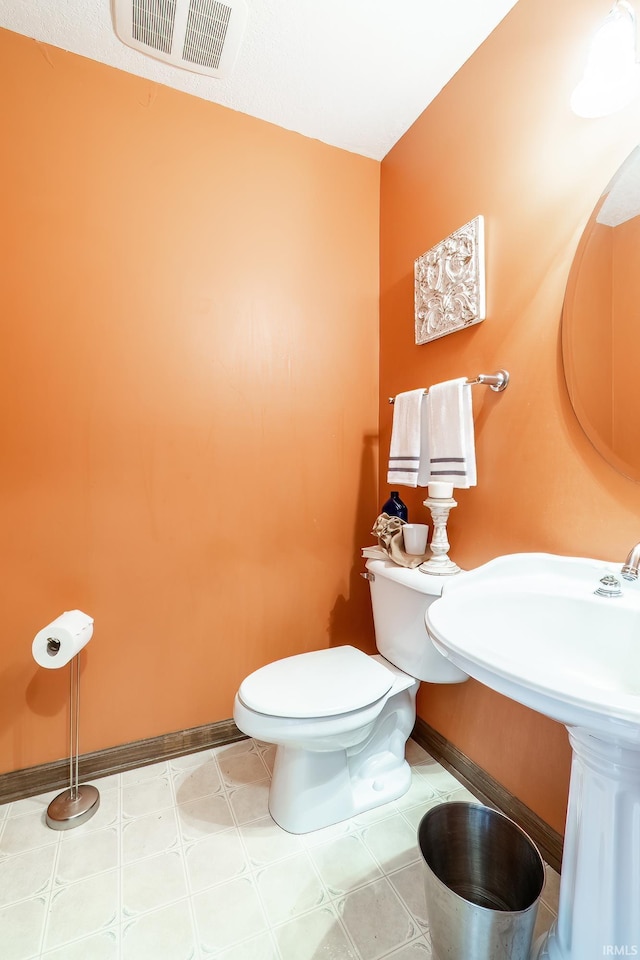 15329 Laurel Ridge Pl, Leo, IN 46765 - half bath with baseboards, toilet, and tile patterned floors